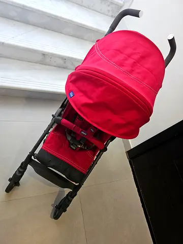 Red lightweight foldable baby stroller - good condition