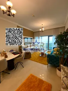 A spacious apartment with easy access to Sharjah and Dubai, close to amenities, in a luxurious tower
