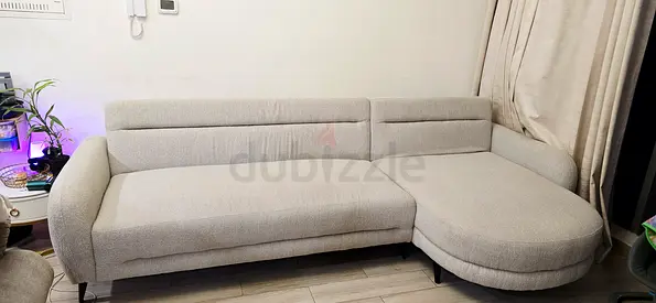 Light grey L-shaped fabric sofa with chaise - good condition - Price Negotiable