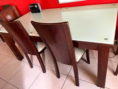 Glass top table with 6 chairs. Solid wood sturdy frame.