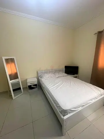 Simple white wooden double bed without mattress - good condition