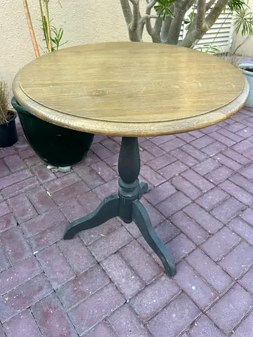 Round wooden side table