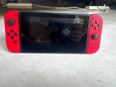 Nintendo Switch console with red Joy-Con - used, working condition