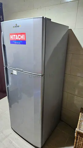 Used Hitachi refrigerator with freezer compartment — excellent working condition