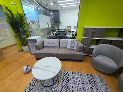 Three-seater grey fabric sofa with matching armchair and coffee table (office lounge set)