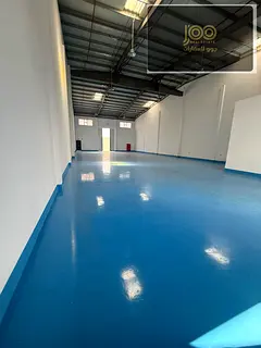 Showroom 5,500 sq ft epoxy UAQ, office + bath + kitchen, main road, AED 290K yearly, ready in 2 week
