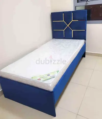 Single Blue Upholstered Bed with Headboard