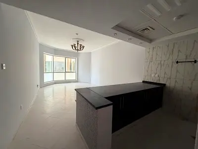 American kitchen with free AC, gym & pool. Prime vibrant location near cafes, shops, pharmacies, malls, and close to Dubai exit.