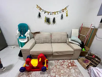 Beige 2-Seater Sofa with Cushions — Good Condition pickup talal supermarket hor al anz