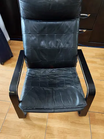 Black leather lounge chair with wooden frame - used