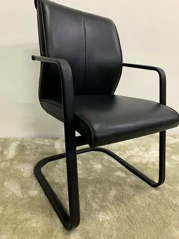 Black leather guest chair