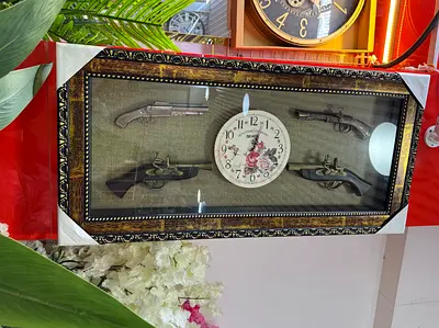 Framed Decorative Antique-Style Pistols with Central Floral Clock
