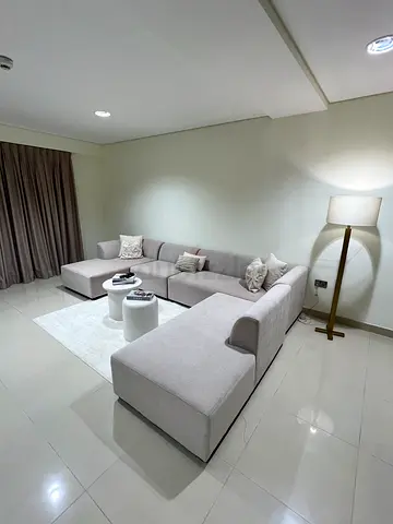 BRAND NEW CUSTOM made L shape sofa for sale with concrete coffee table , carpet and standing lamp
