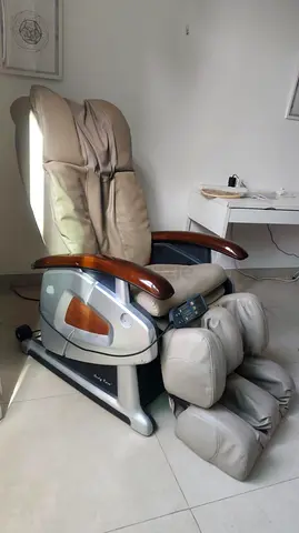 Used full-body electric massage chair in beige with footrest 699 only