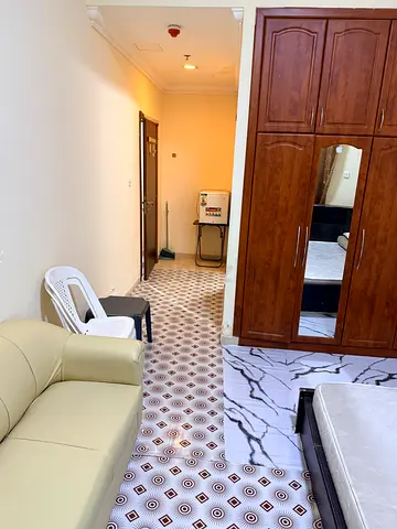 Furnished master bedroom with attached bathroom and balcony