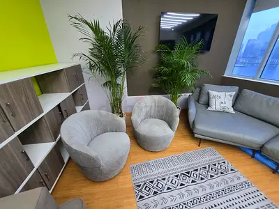 Pair of Grey Swivel Lounge Chairs — Good Condition