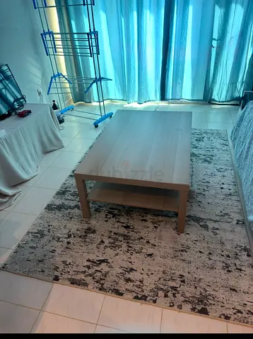 Wooden Coffee Table with Modern Abstract Rug - Good Condition