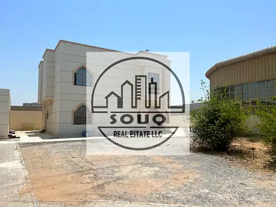 Spacious 6-bedroom villa with swimming pool and sitting area.