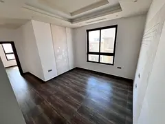 For annual rent in Al Jurf 2: Two bedrooms and a living room, three bathrooms, two master bedrooms,
