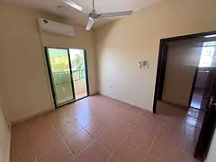 Two-bedroom apartment with a living room - Al Nuaimiya 2, Ajman - Split AC - Family accommodation -