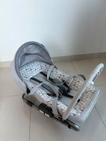 Baby rocker/seat in grey geometric print — gently used