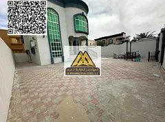 Villa for rent in Al Rawda 3, Ajman, corner location with large green spaces, consisting of 5 rooms,