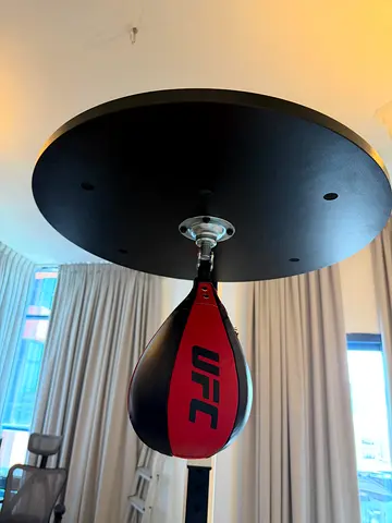 Heavy bag and speed bag base rack stand