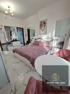 Super deluxe one-bedroom apartment for rent in Oasis Tower 1, Ajman, with an open view. Includes in