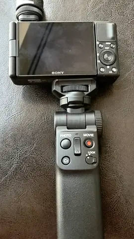 Sony compact digital camera with handheld grip / tripod handle (used)