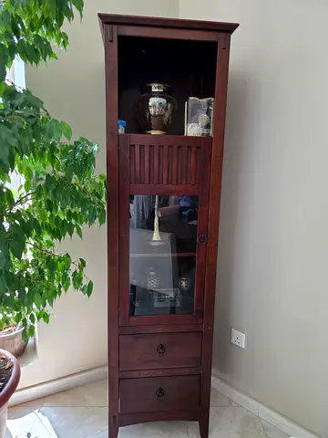 Tall wooden display cabinet with glass door and drawers - solid finish