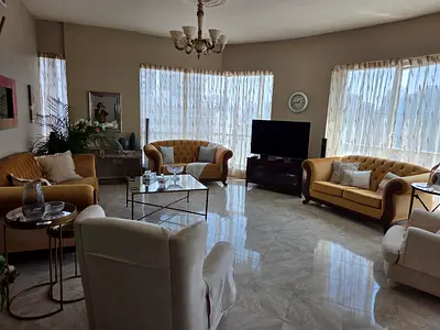 Living room sofa set - 3 sofas two 2 seats , one 3 seats .. beige color with wood .. in good ndition