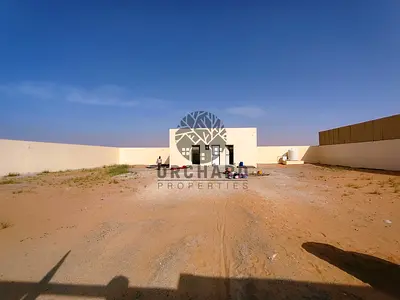 Open yard with electricity available for annual rent – AED 115,000.