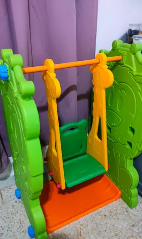 Plastic Indoor Baby Swing with Lion Panels - Good Condition