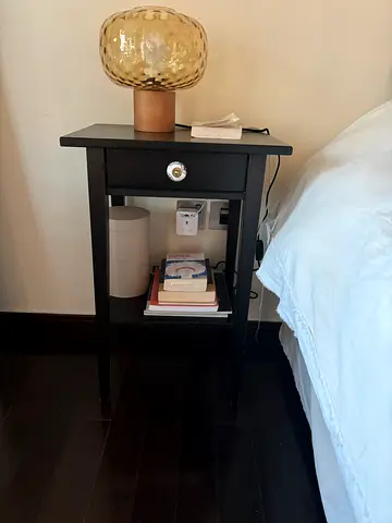 Black wooden bedside table