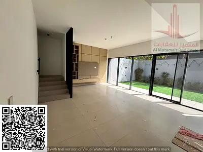 Townhouse for rent in Aljada area, consisting of three bedrooms, a living room, and a maid's room. Area: 2000 sq m