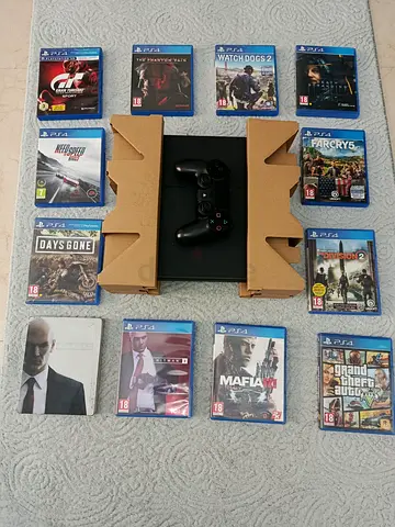 playstation 4 with one original controller and 12 cd gaming.