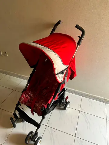 Lightweight red umbrella stroller in good condition