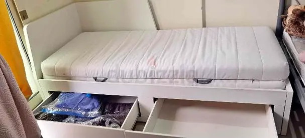 Ikea flekke day bed frame with 2 storage drawers underneath the bed and 2 Ikea mattresses