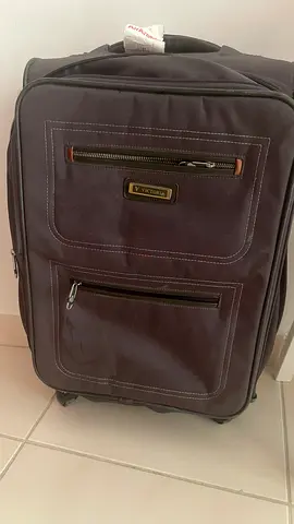 Used Victorinox soft-shell rolling suitcase - medium size, good condition