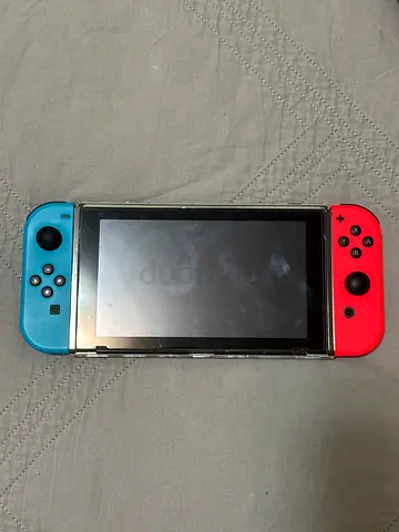 Used Nintendo Switch console with SuperSmash Bros Ultimate game and more.