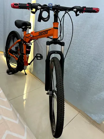 Orange foldable city bike - light used, good condition