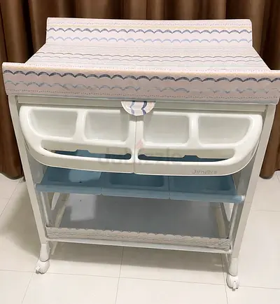 Juniors baby changing table with storage bins, removable changing pad and baby bath inside
