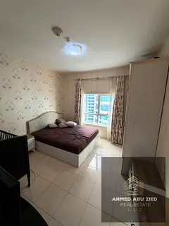 Furnished 1-bedroom apartment in Orient Towers | Sea view | Balcony | 2 bathrooms | Gym &amp; pool |