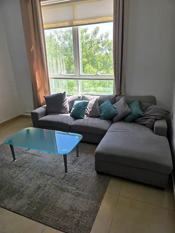 Grey L-shaped Corner Sofa with Cushions and coffee tables