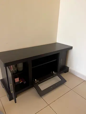 Compact dark wood TV stand / storage cabinet with glass door