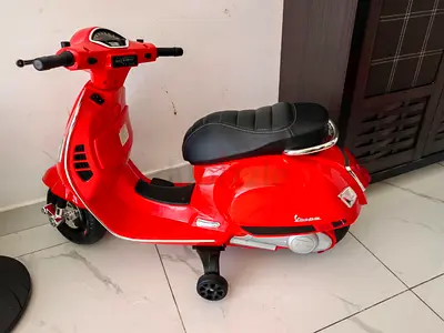 Red Vespa-Style Electric Ride-On Scooter for Kids with Training Wheels