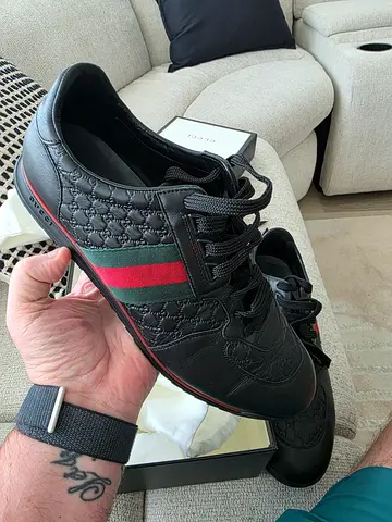 Gucci black Microguccissima leather sneakers featuring the signature red and green size uk 10