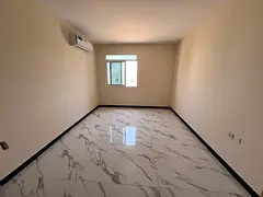 A one-bedroom apartment for annual rent in the Al Zahiyah area of ​​Ajman, located in a quiet an