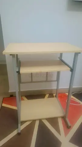 Compact computer desk with keyboard tray and shelf — light wood finish