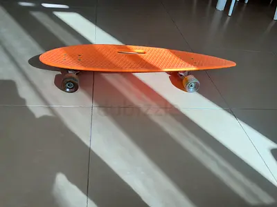 Orange Plastic Cruiser Skateboard - Compact, Light Use